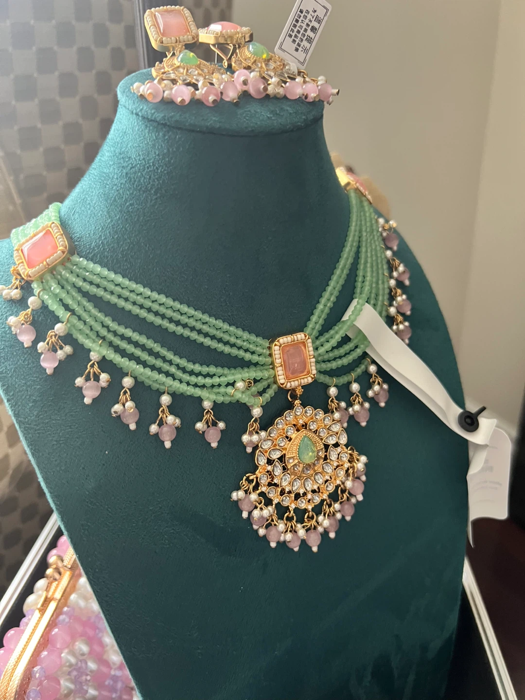 Green beaded necklace and earring set with pink accents
