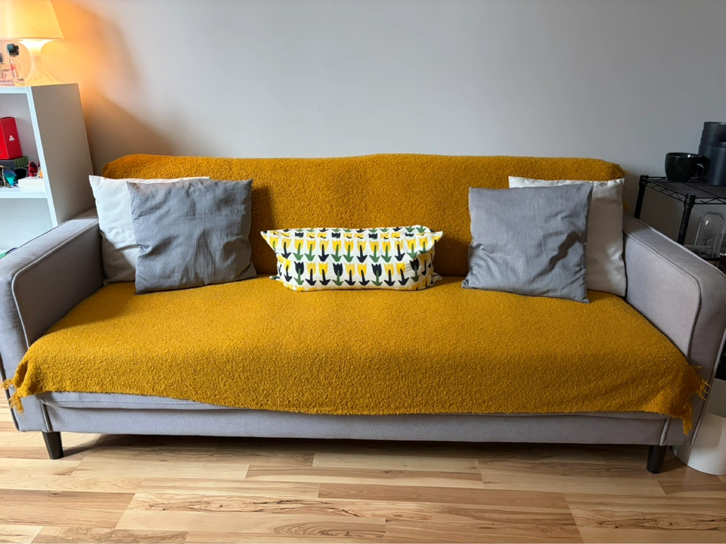 Gray Sofa with Yellow Throw and Accent Pillows