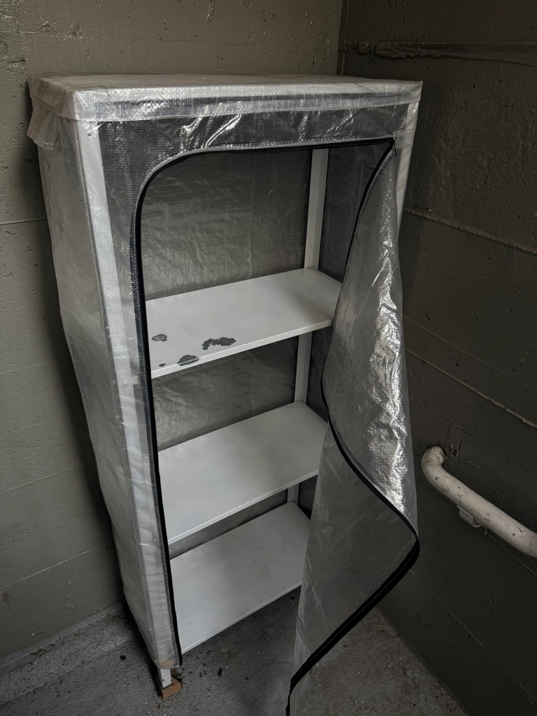 Shelving unit with assorted plant pots and garden supplies - photo 4