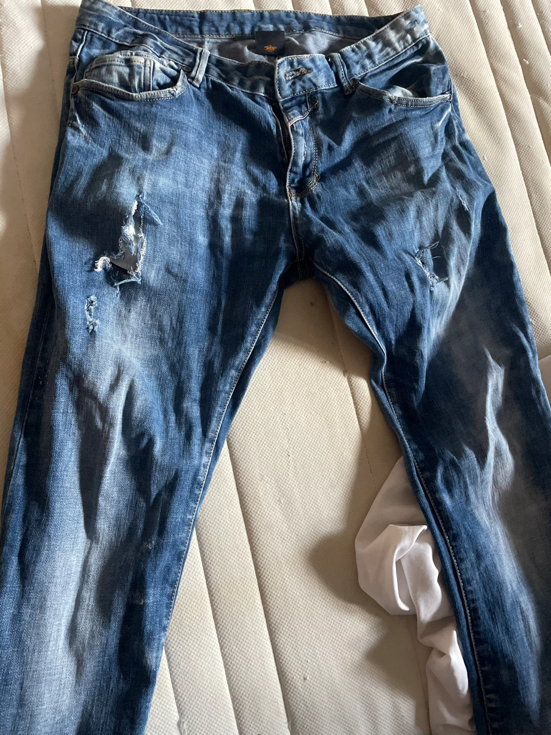 Distressed Blue Denim Jeans