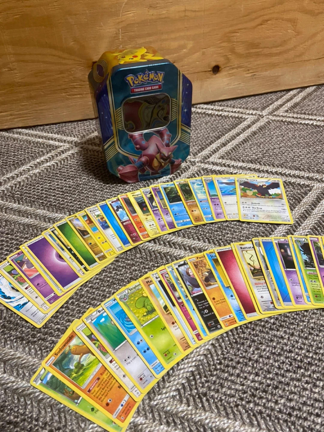 Assorted Pokemon Cards + Pokemon Tin