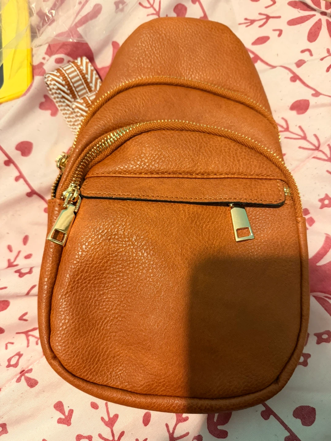 Brown Faux Leather Sling Backpack with Patterned Strap
