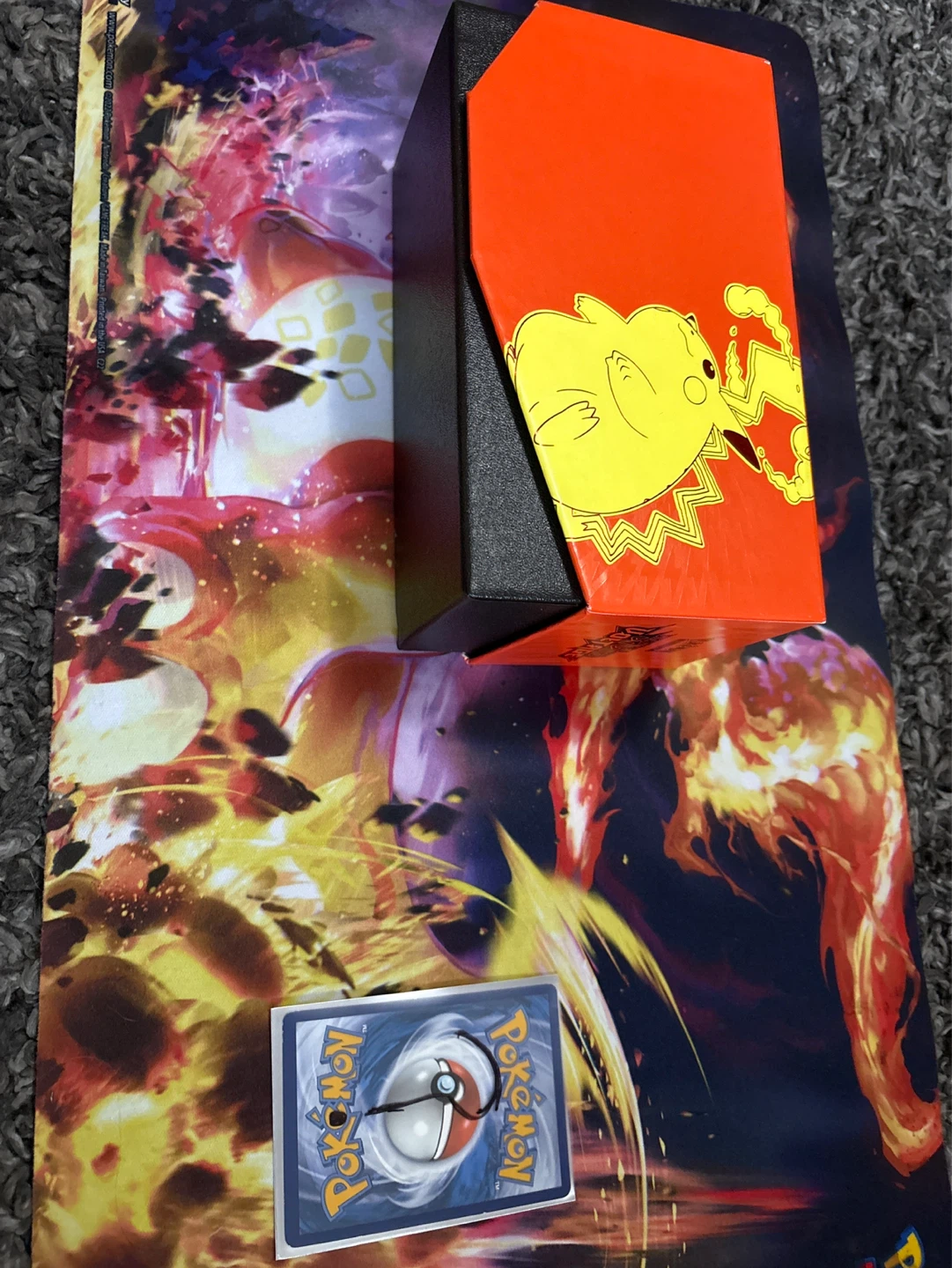 Pokémon storage box with cards in it and mystery card?