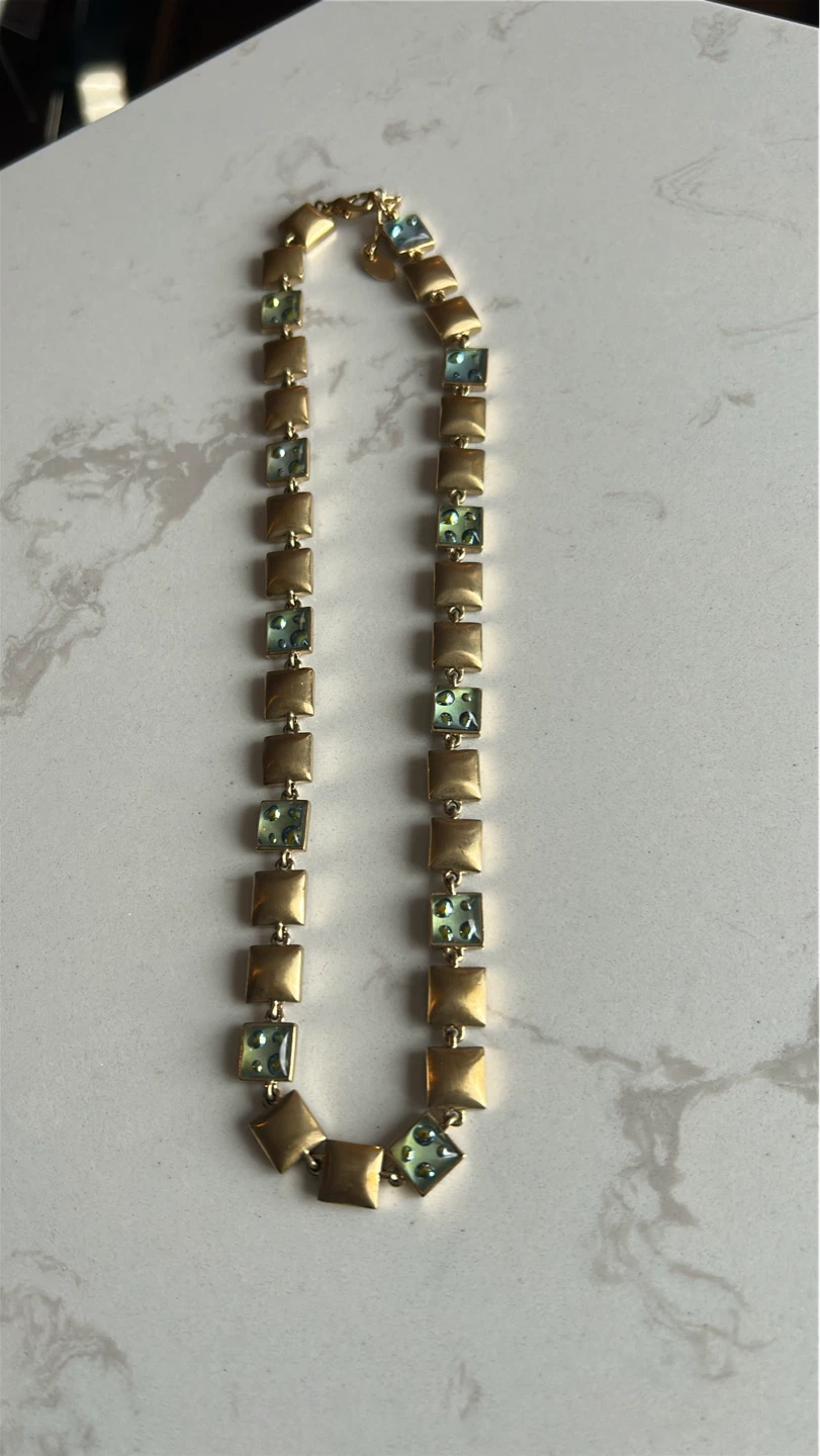 Gold-tone necklace with square green accents