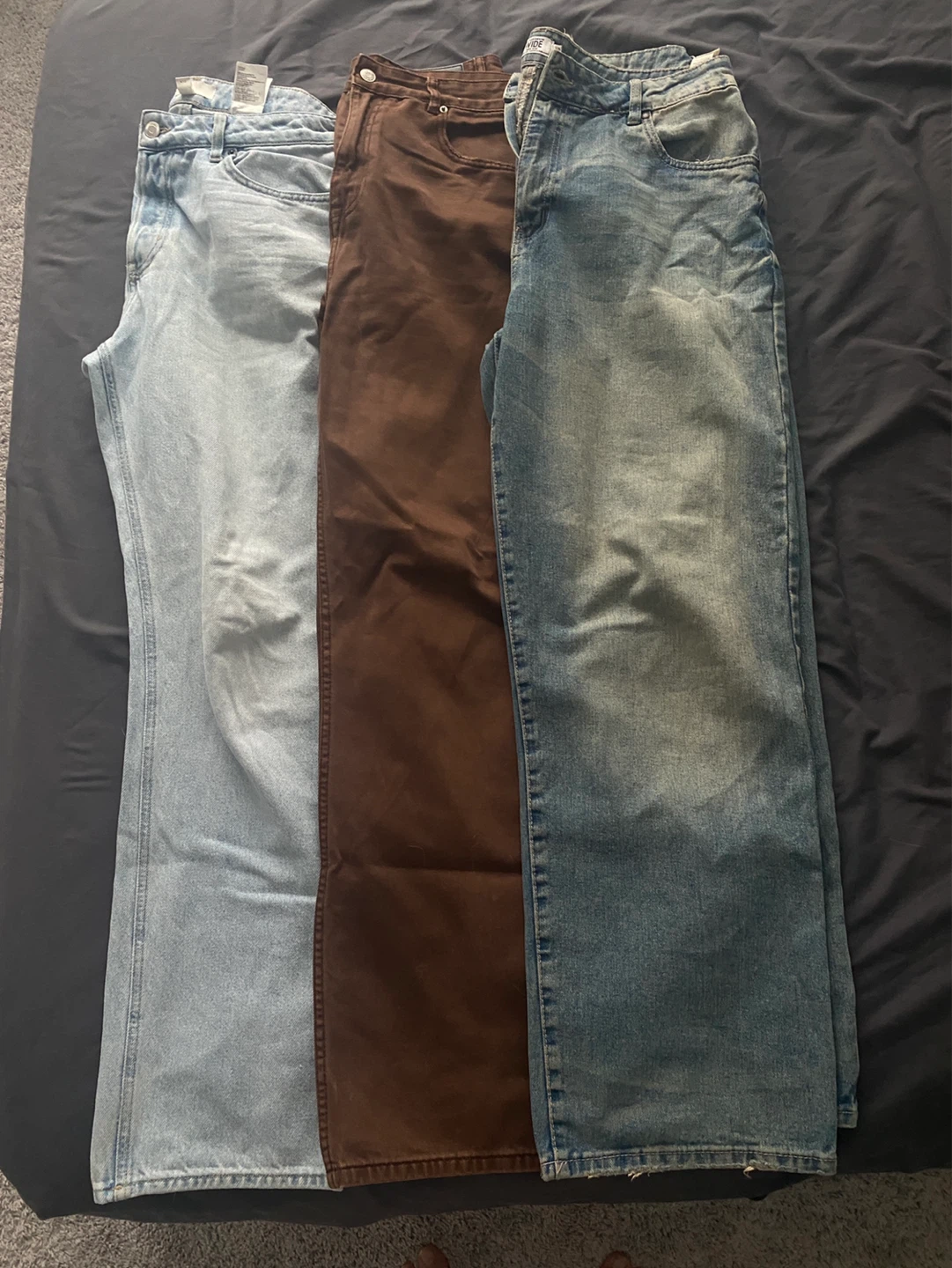 Three Pairs of Jeans - Light Blue, Brown, and Blue