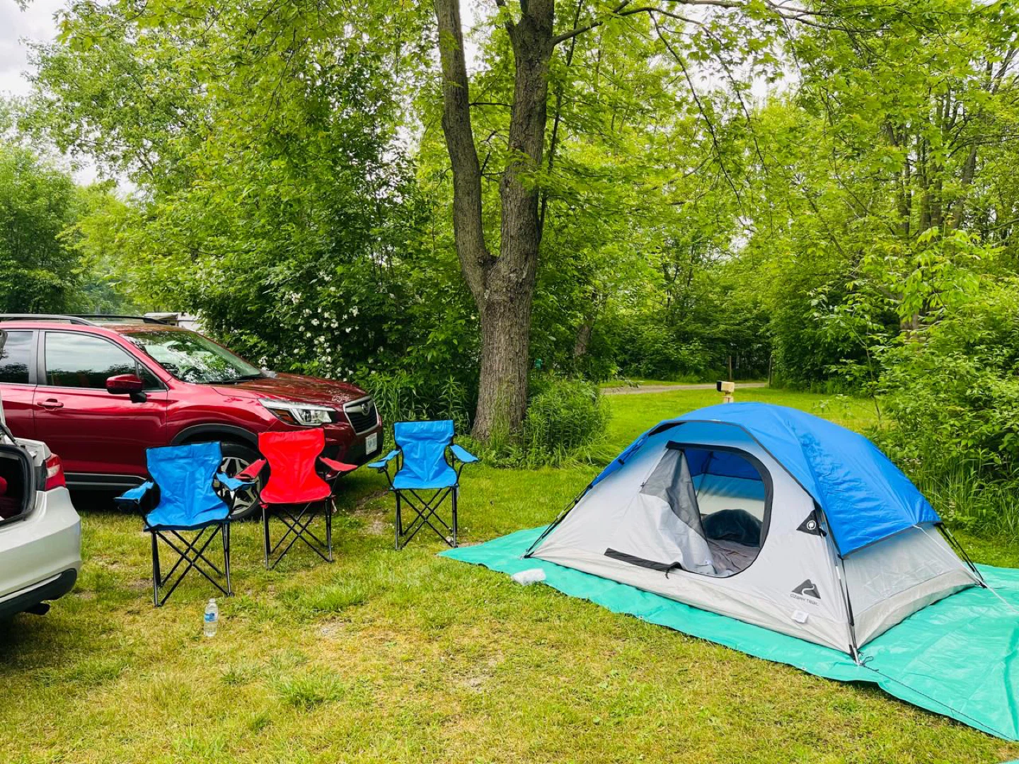 Ozark Trail Blue Camping Chair and tent with tarps