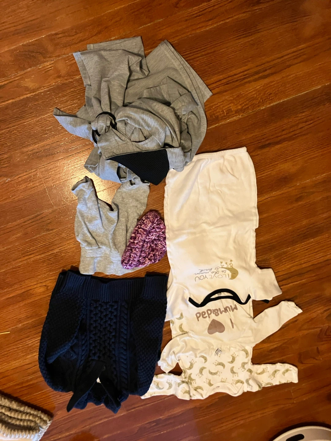 Baby clothes and carrier