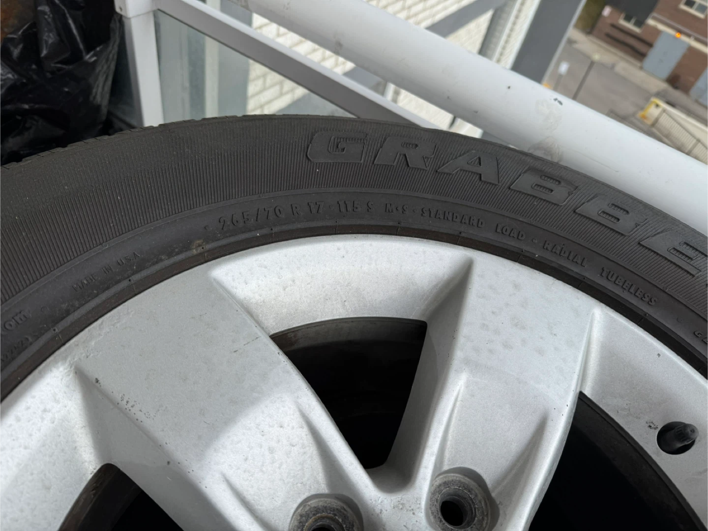 265/70R17 Grabber AT2 Tire with Rim - photo 4