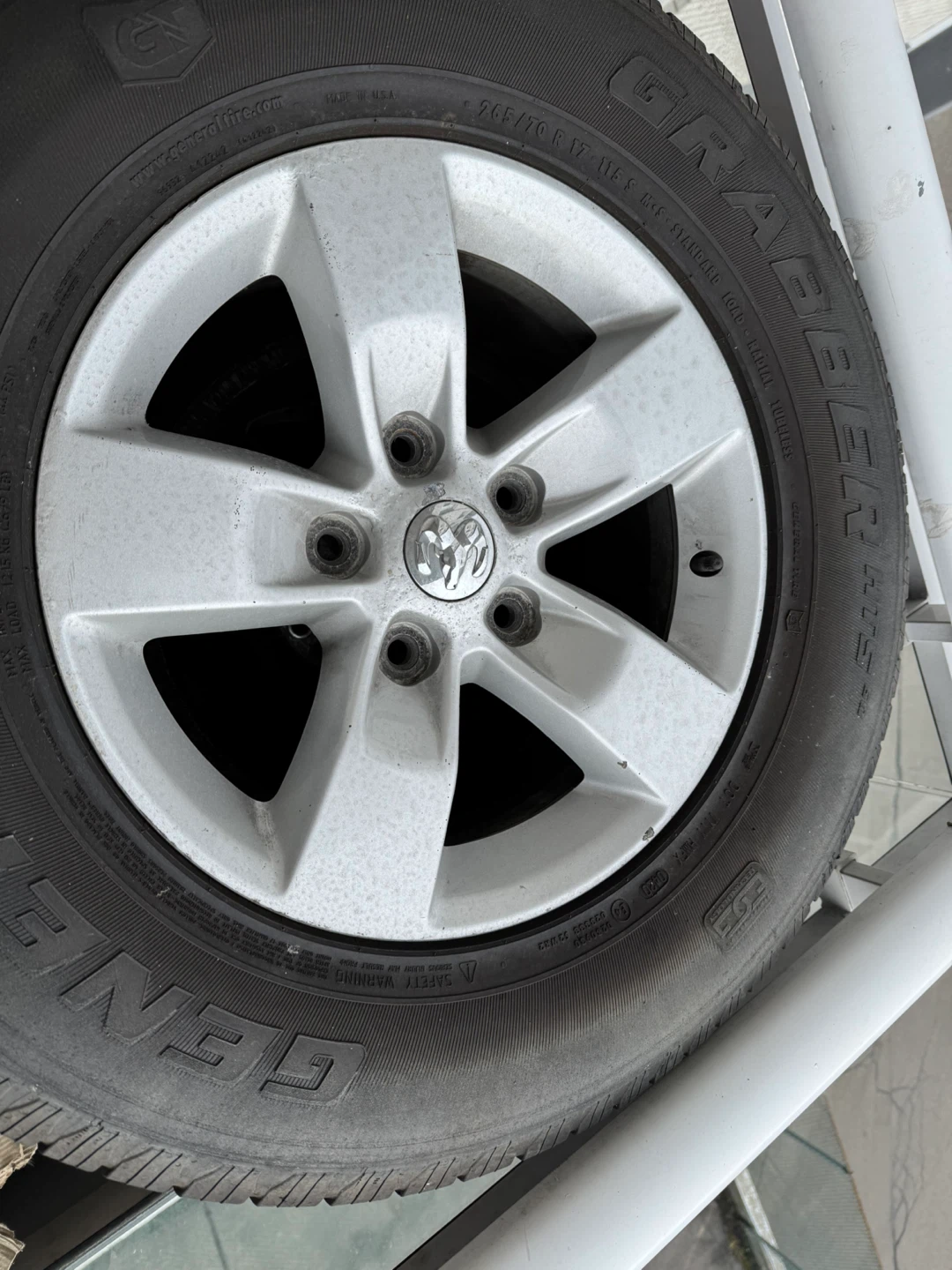 265/70R17 Grabber AT2 Tire with Rim