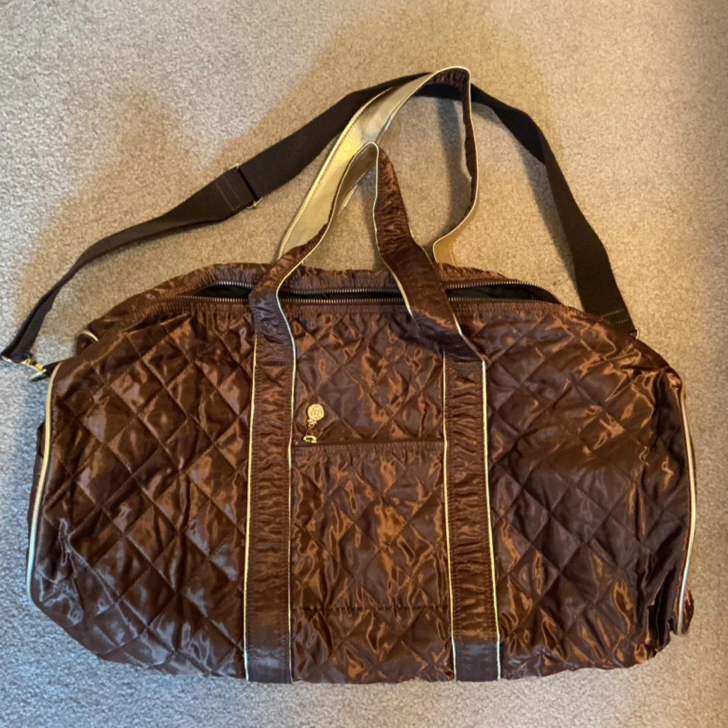 Brown Quilted Duffel Bag with Gold Accents