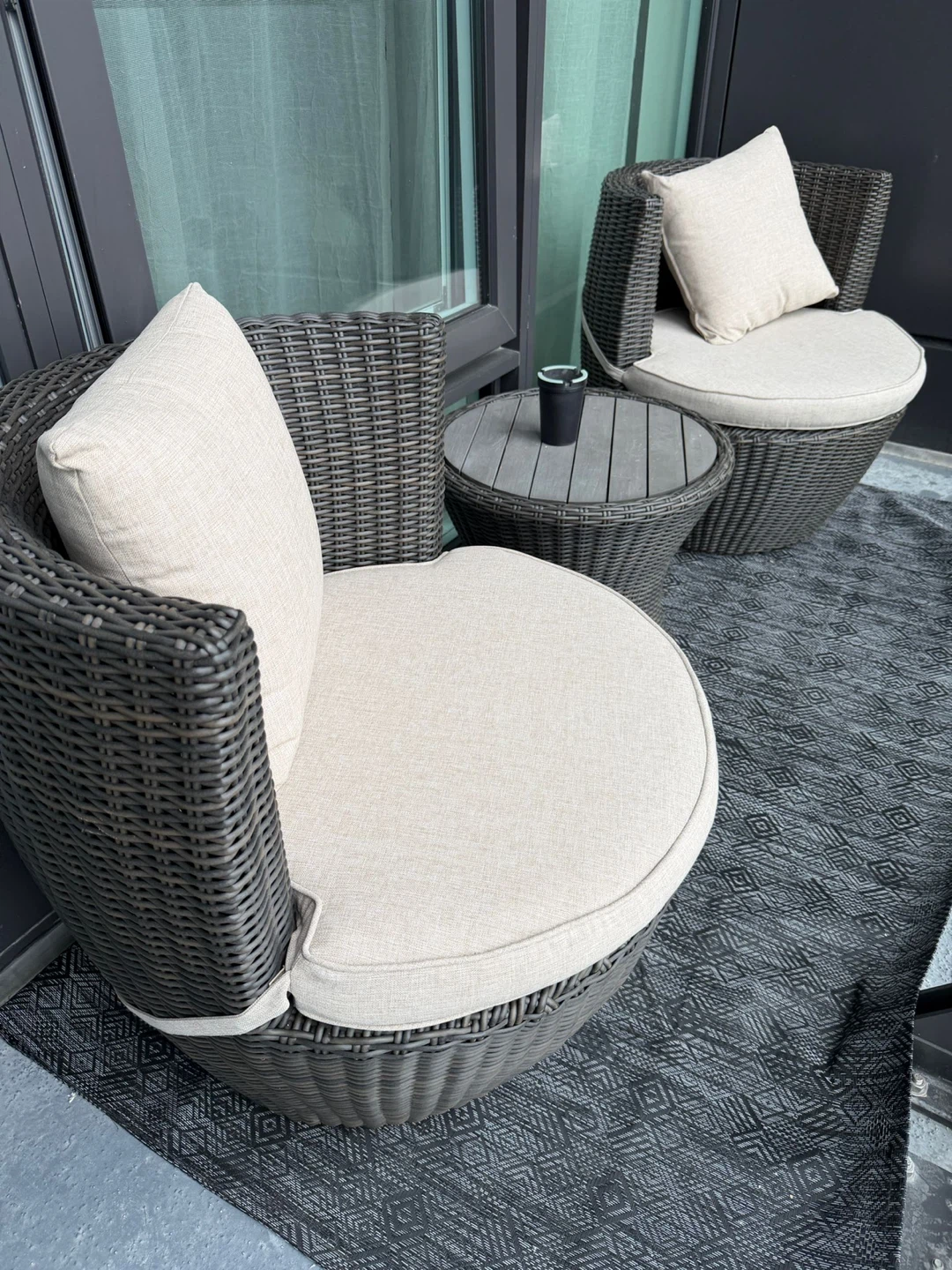 Wicker patio set with two chairs and side table