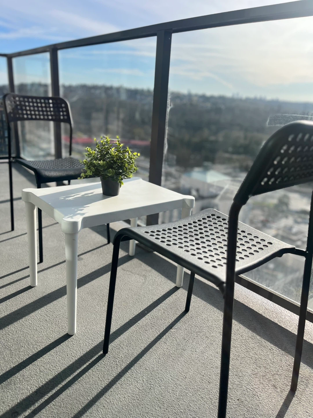 White Side Table and 2 Black Chairs Set