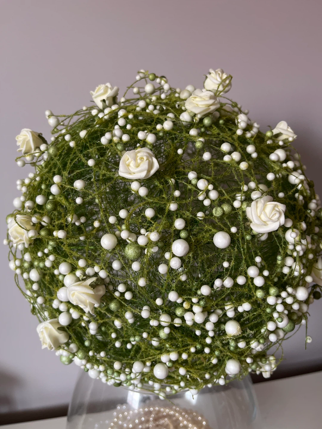 Green floral topiary sphere with white roses and beads