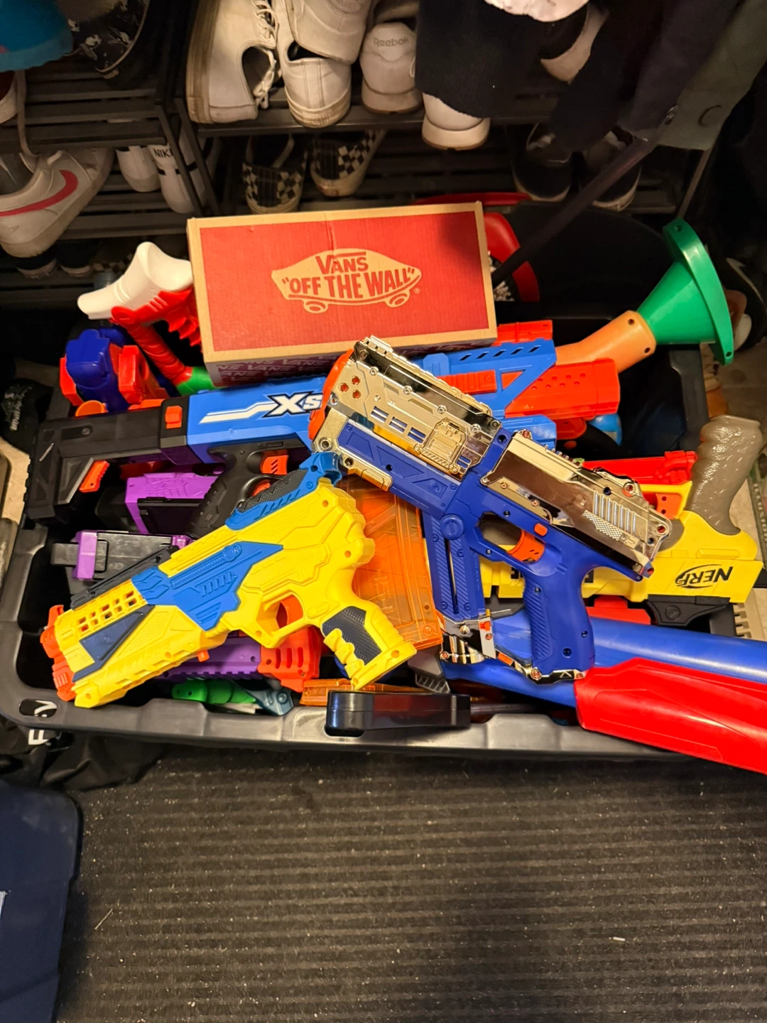 Assorted nerf Guns and foam darts