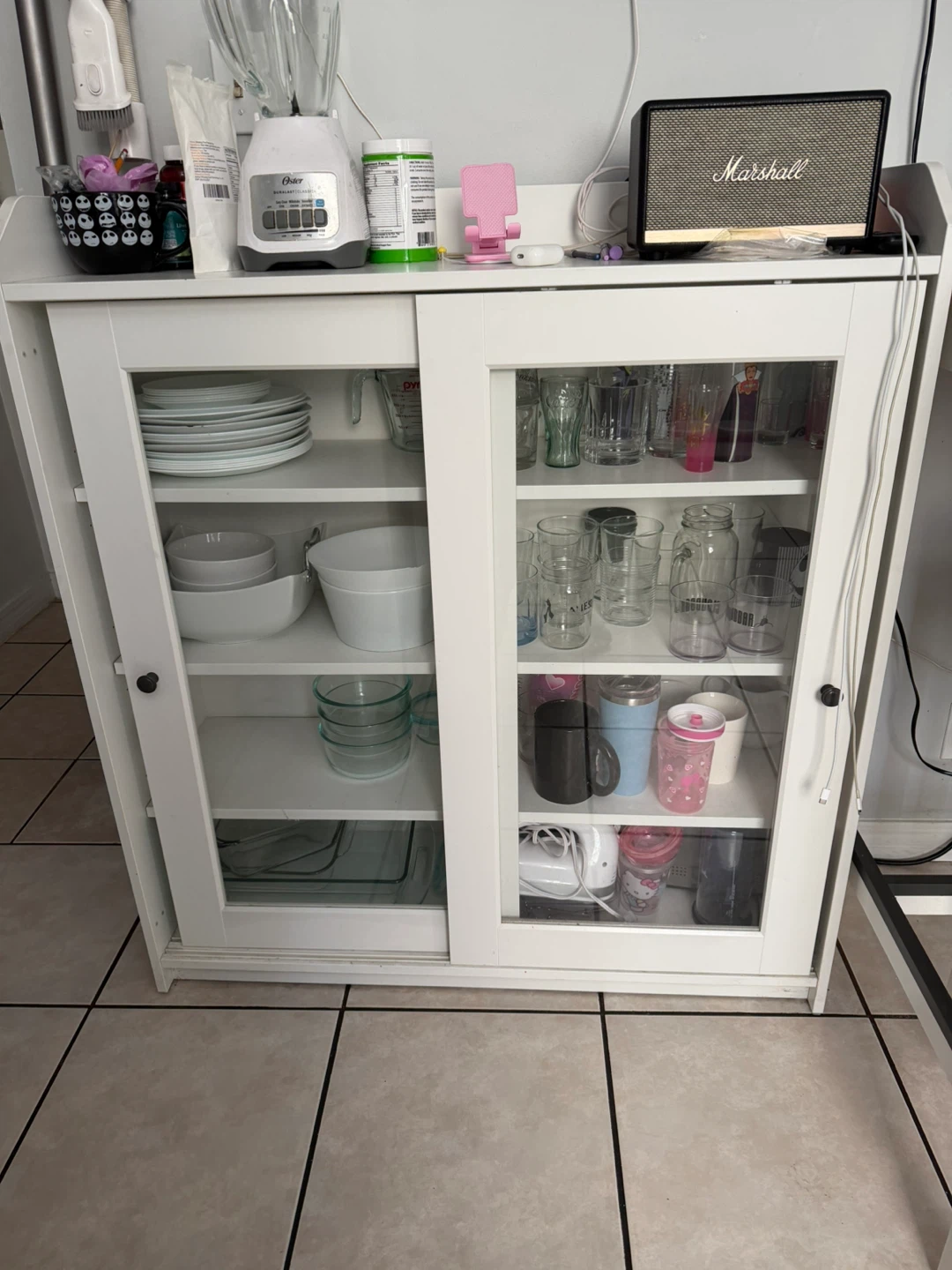 White Storage Cabinet with Sliding Glass Doors