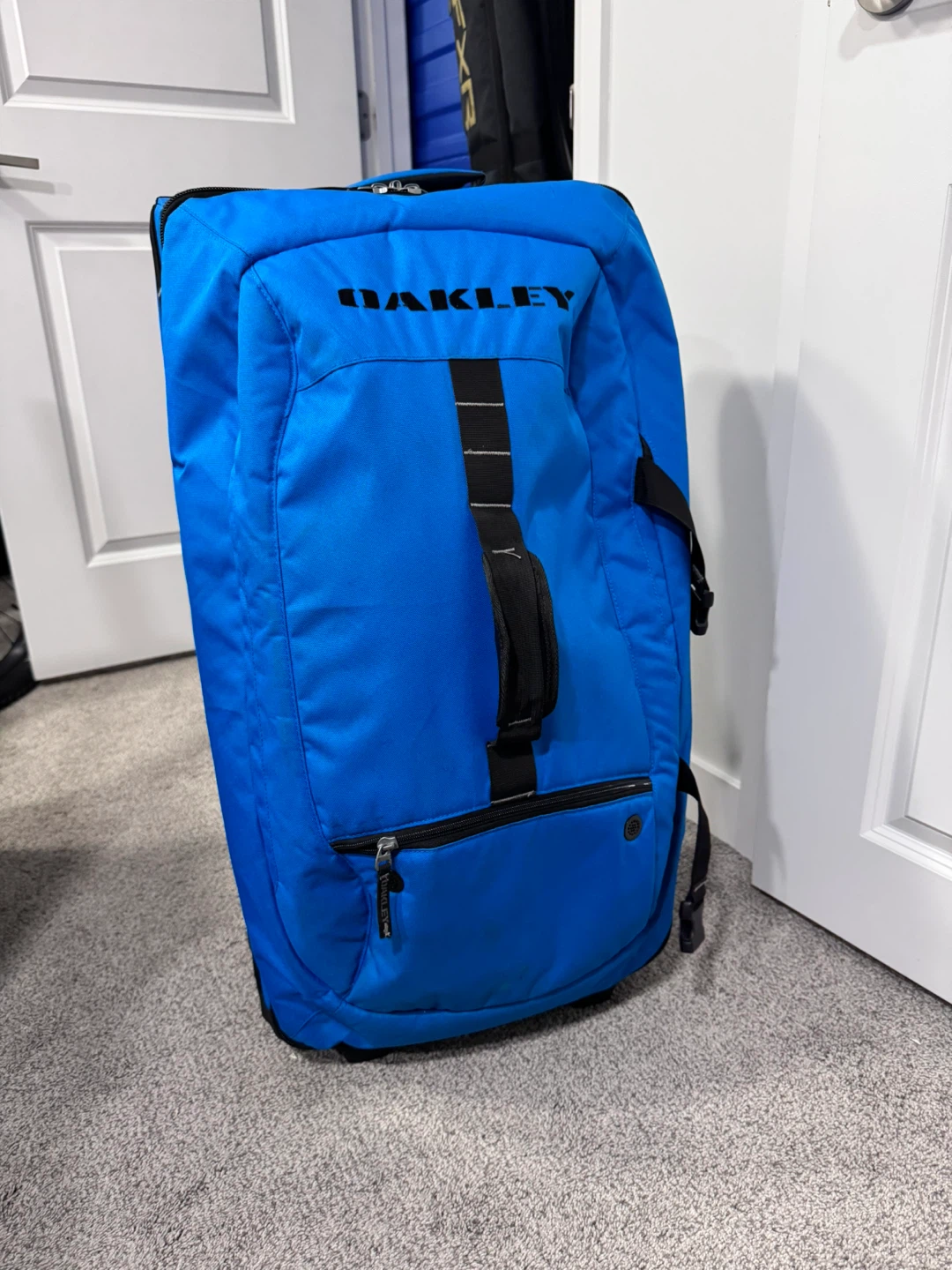 Oakley Blue Rolling Suitcase Travel Bag