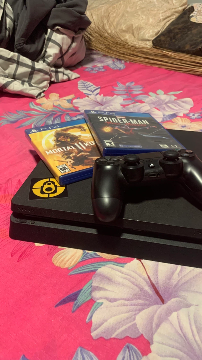 PlayStation 4 Slim Console with Controller and Games