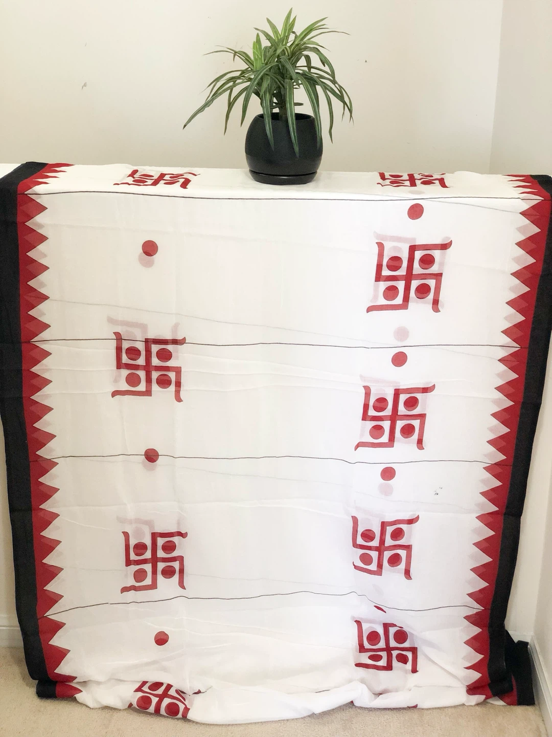 White cotton mulmul Saree with Red Swastik and Black Border