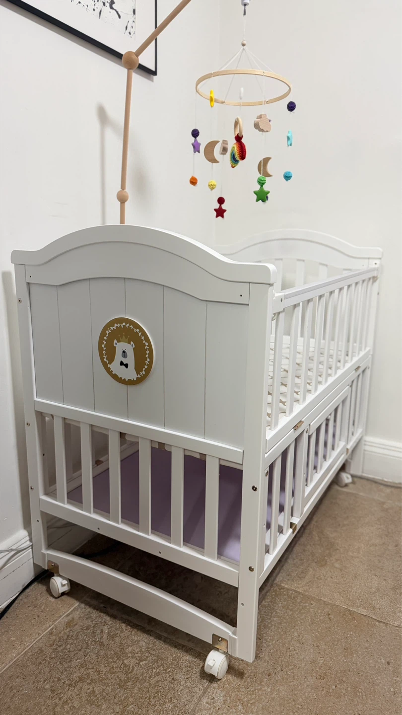 White Baby Crib with Mobile