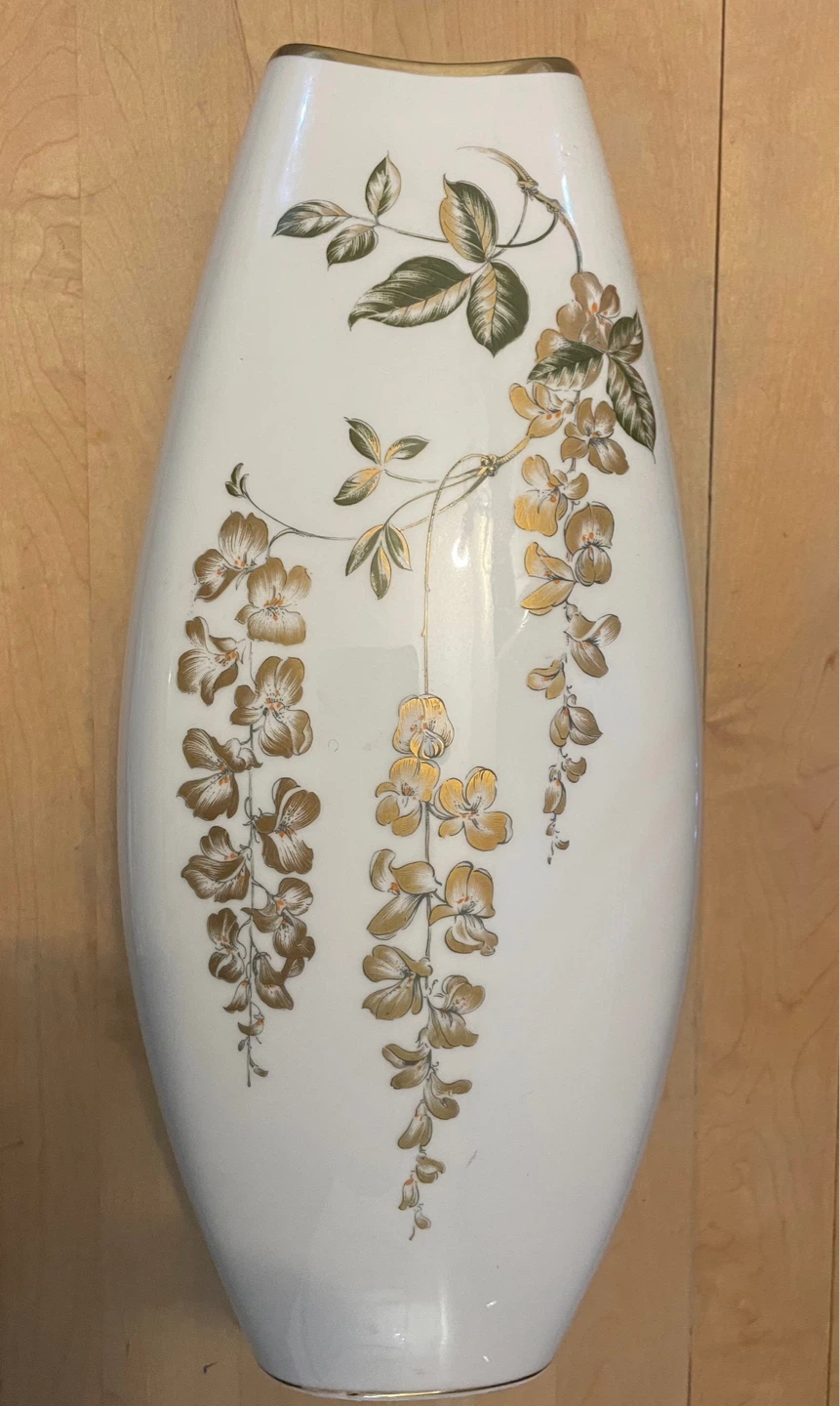 White vintage porcelain vase with gold floral detail