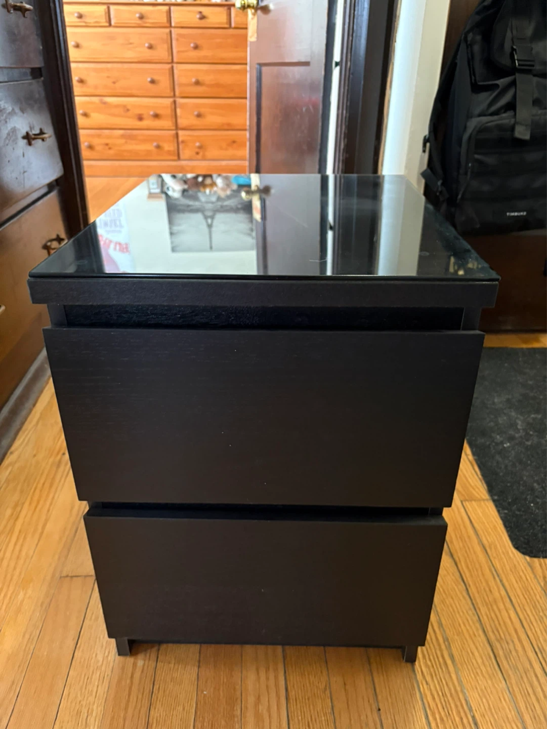 Malm nightstand from IKEA with glass top.