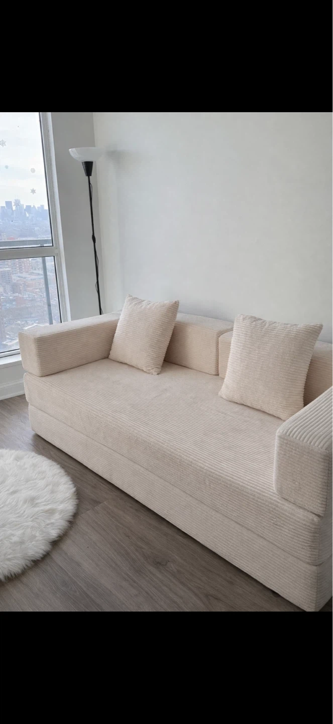 Beige Convertible Sofa Bed with Pillows