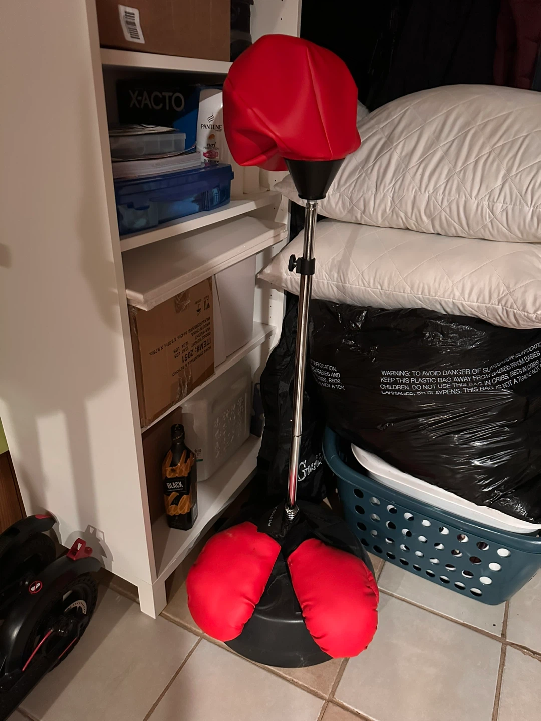 Red Punching Bag with Boxing Gloves