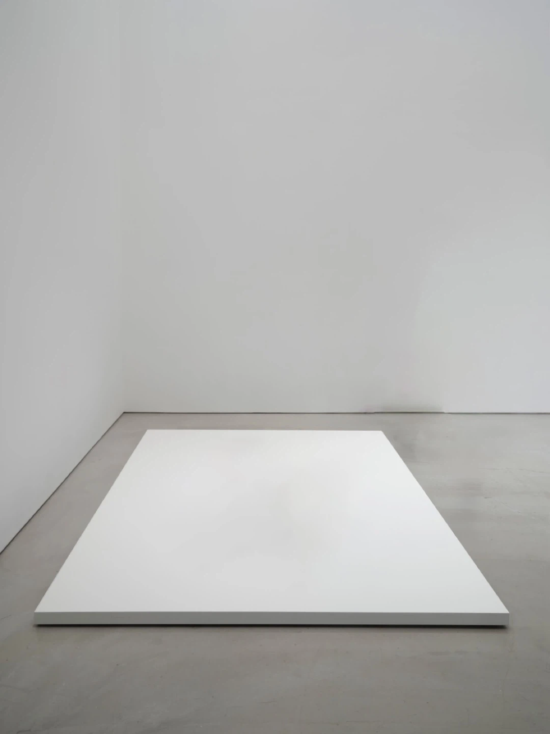 Custom-built large low white pedestal