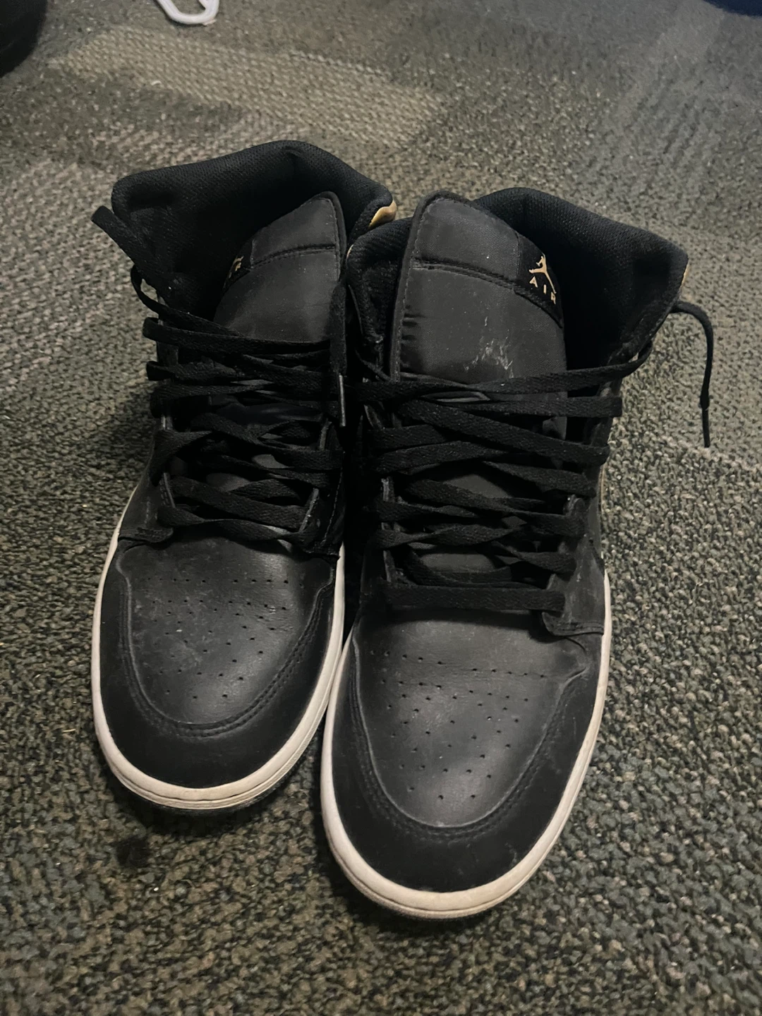 Air Jordan 1 Mid Black Gold Sneakers