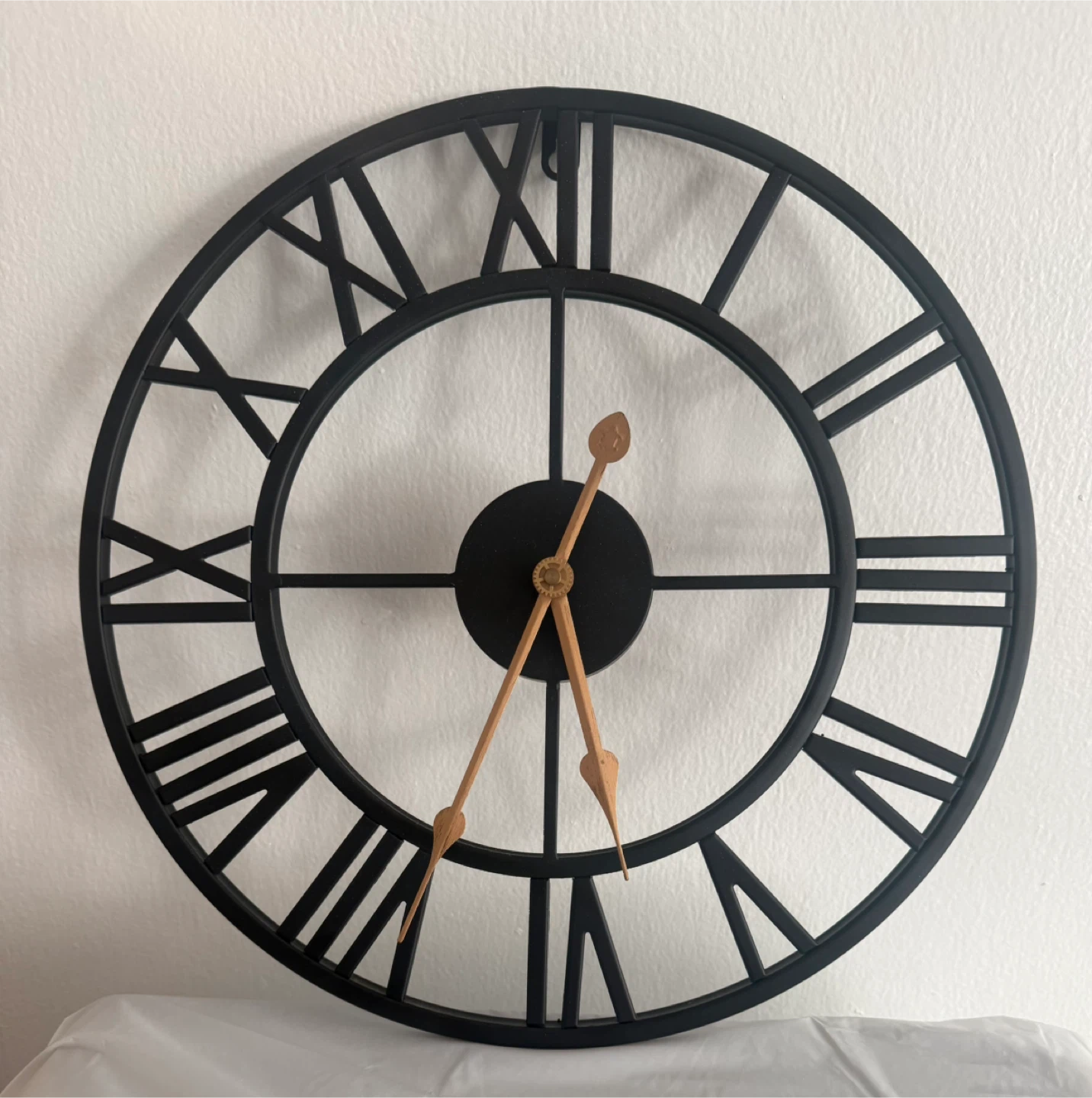 Black Metal Roman Numeral Wall Clock