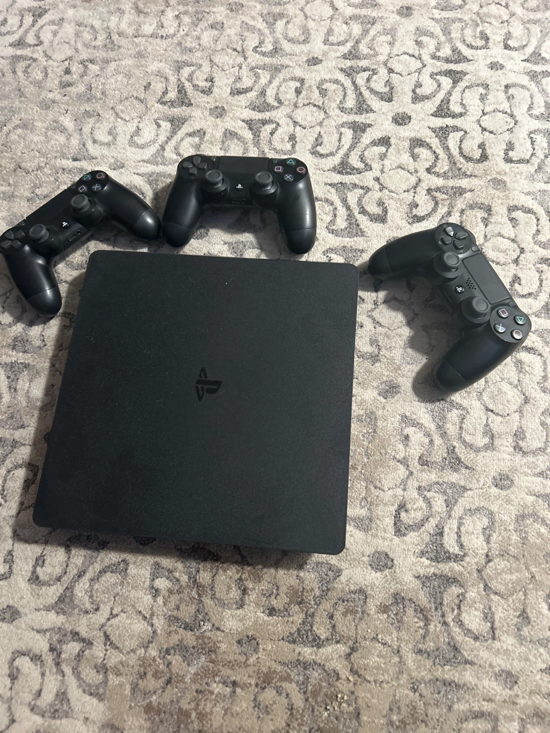 Sony PlayStation 4 Slim Console with 3 Controllers.
