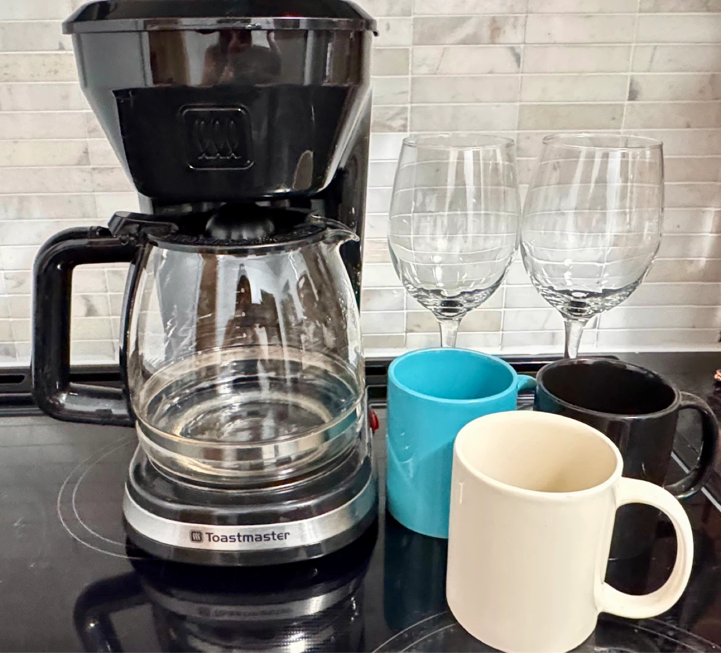 Coffee Maker with Mugs and Wine Glasses