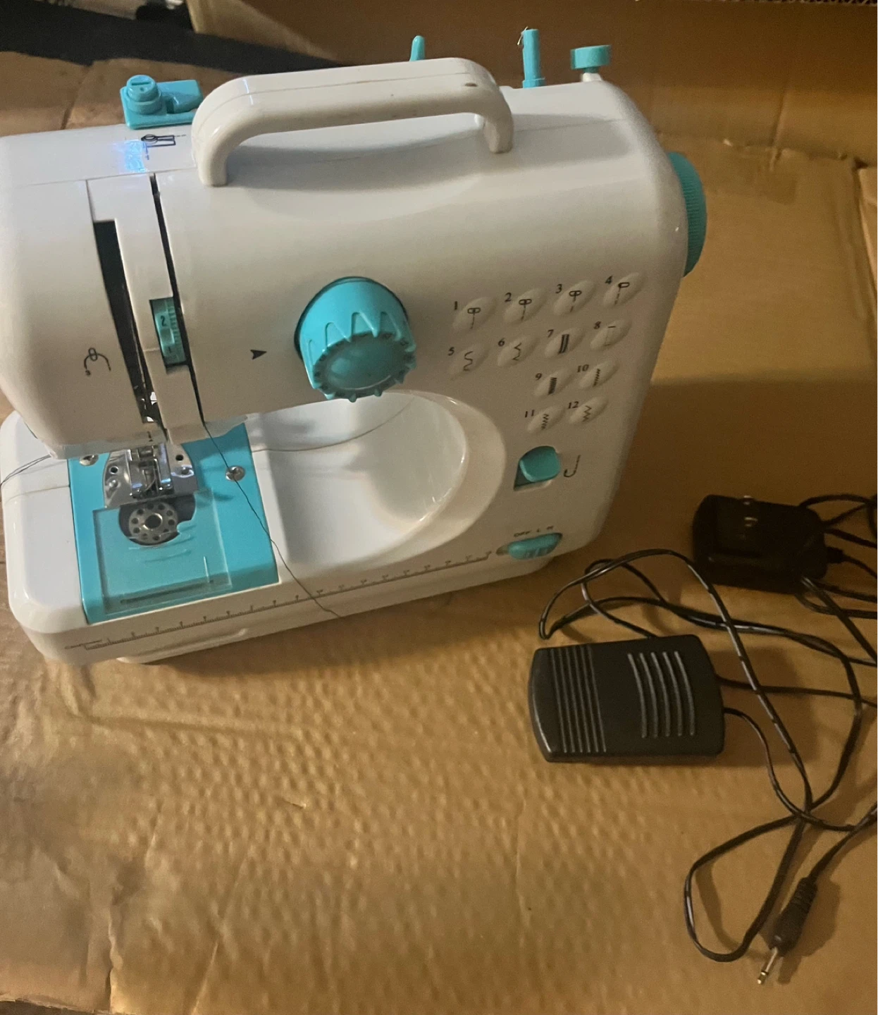 White and Teal Portable Sewing Machine with Accessories
