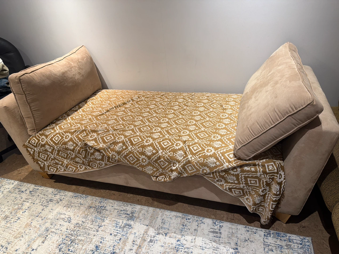 Beige Sofa with Patterned Throw