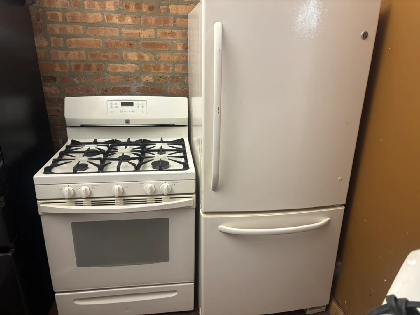White GE Gas Range and Refrigerator Set