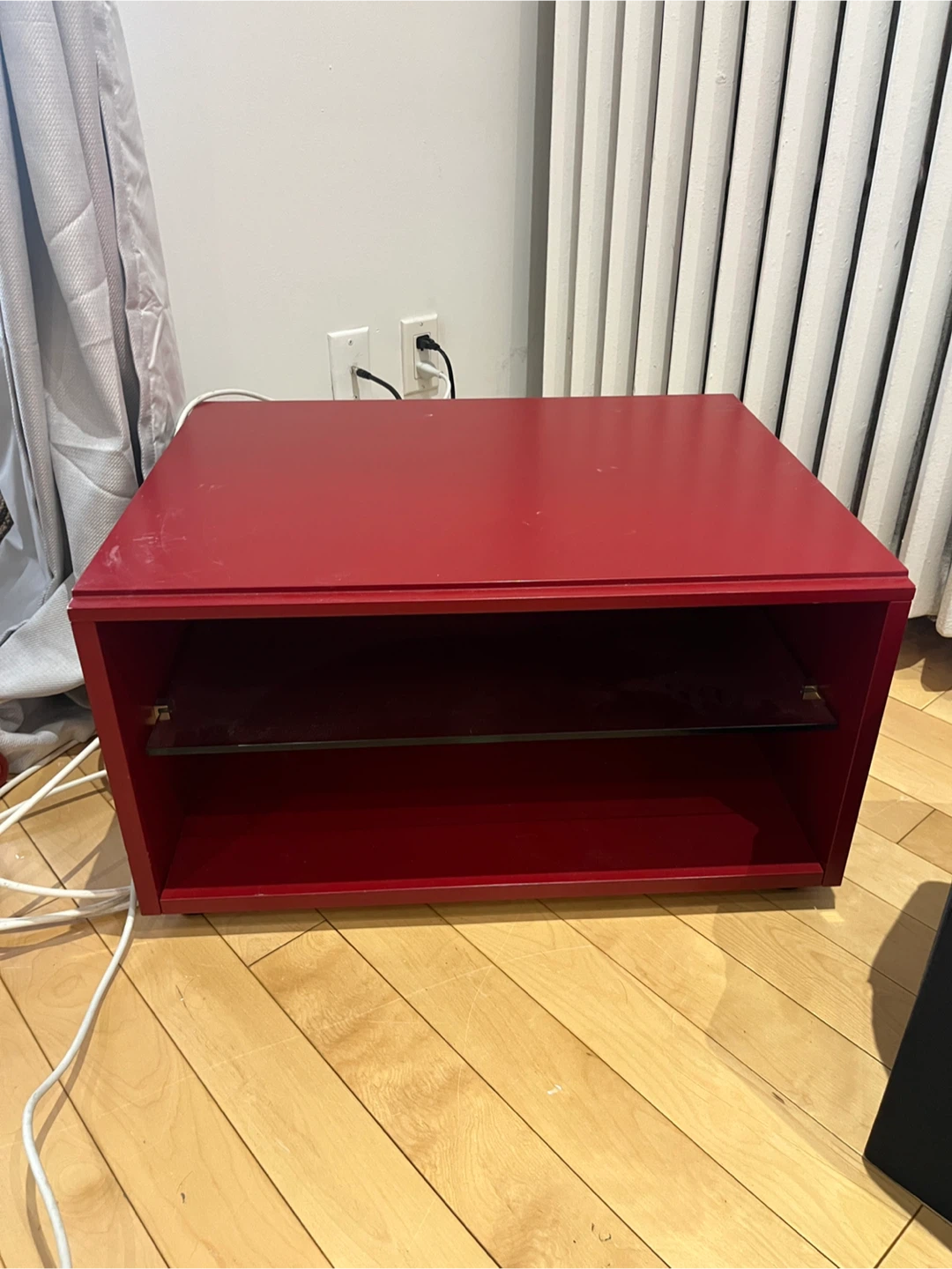Red media console with glass shelf