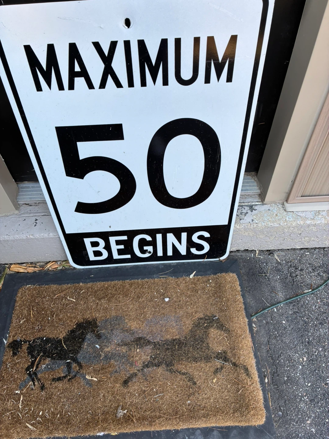 Maximum 50 Begins Speed Limit Sign