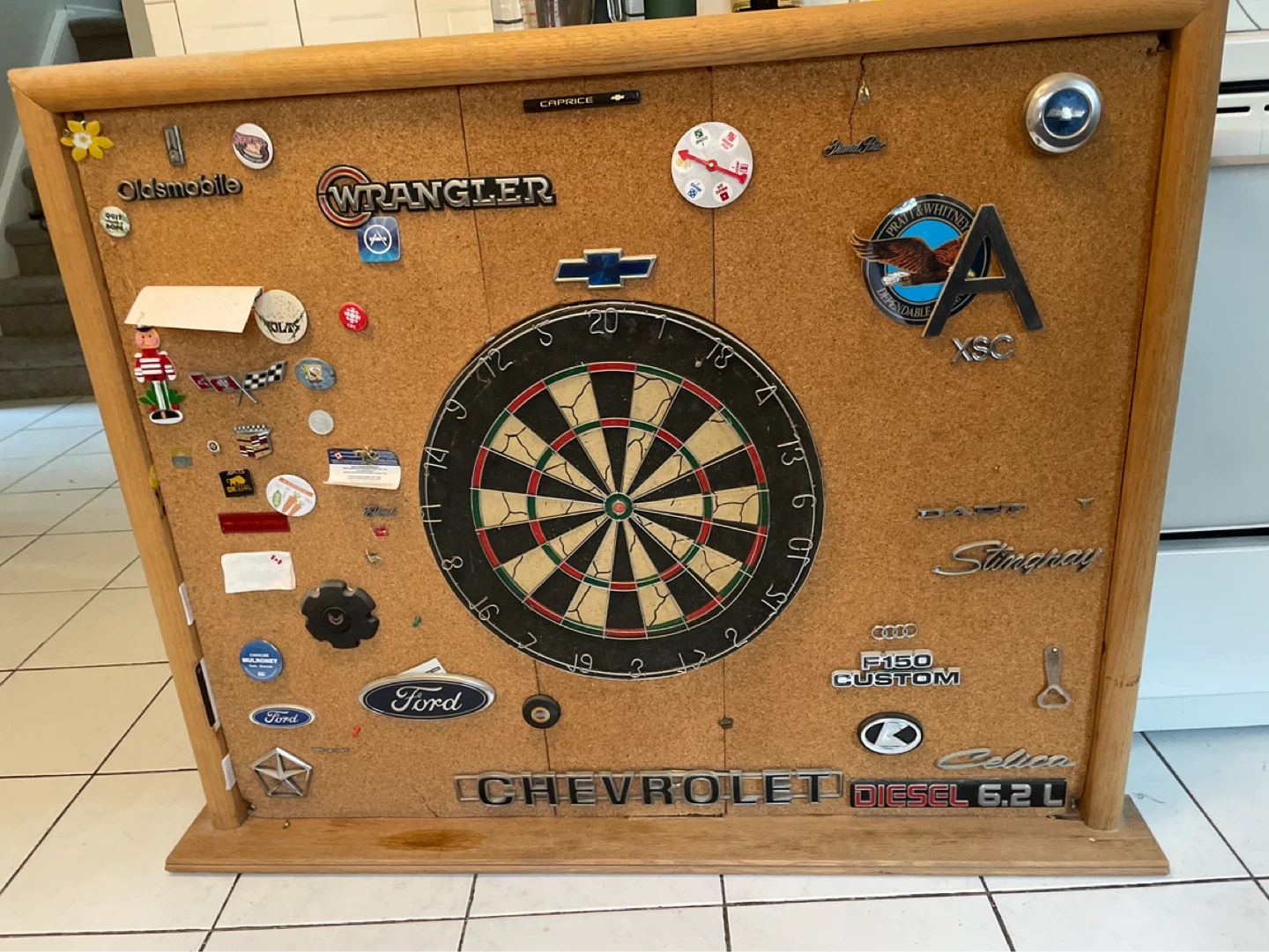 Dartboard with assorted car and brand emblems