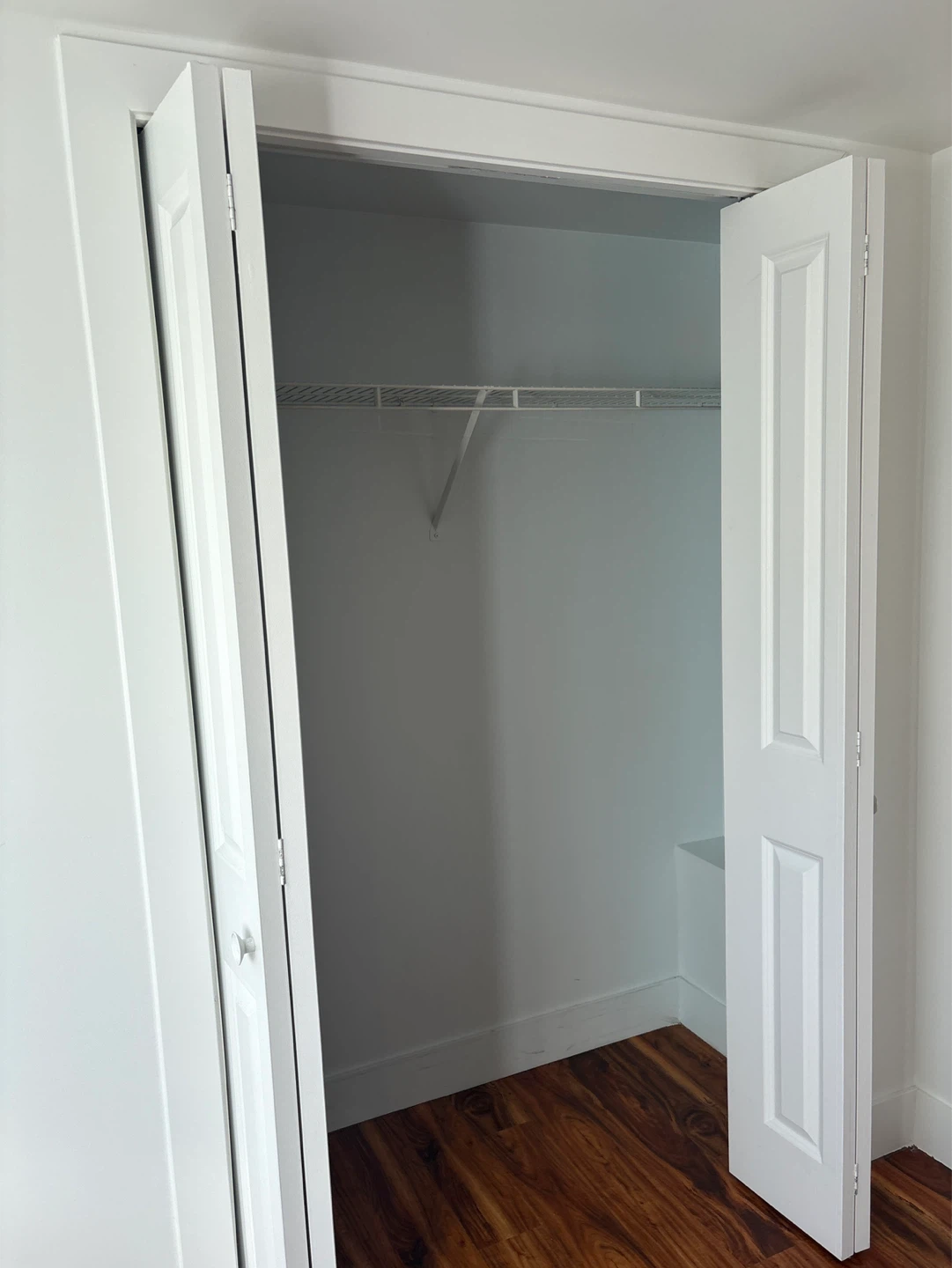 Empty Room with Laminate Flooring and Window - photo 3