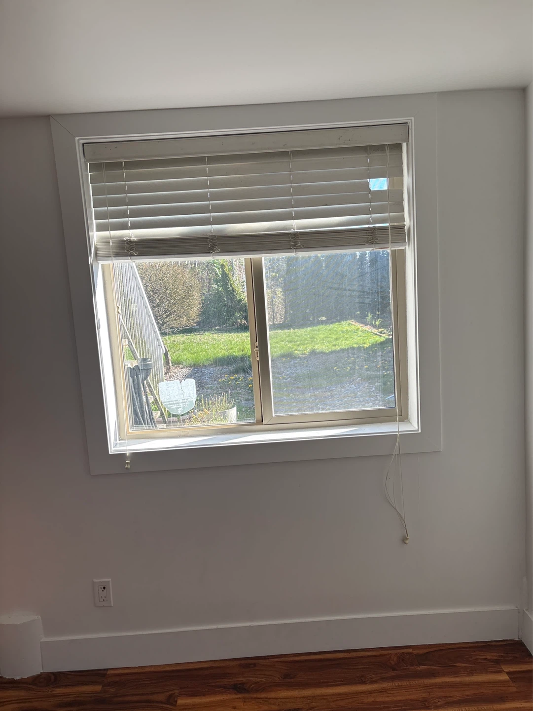 Empty Room with Laminate Flooring and Window - photo 4
