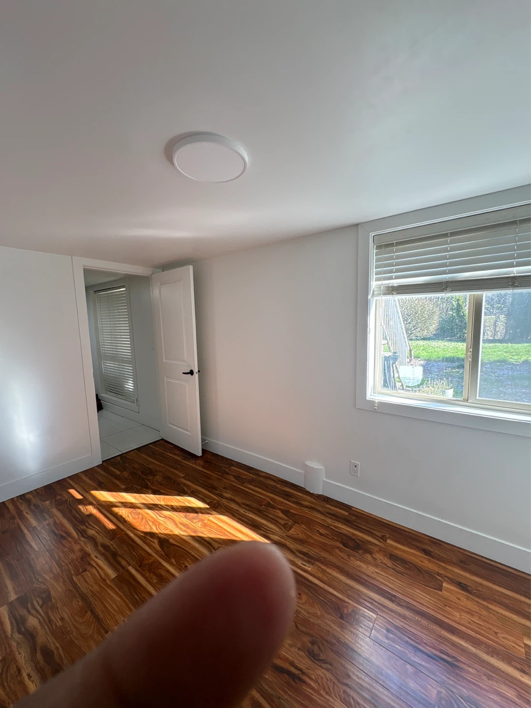 Empty Room with Laminate Flooring and Window - photo 5