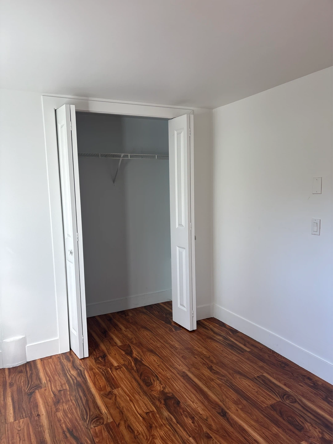 Empty Room with Laminate Flooring and Window