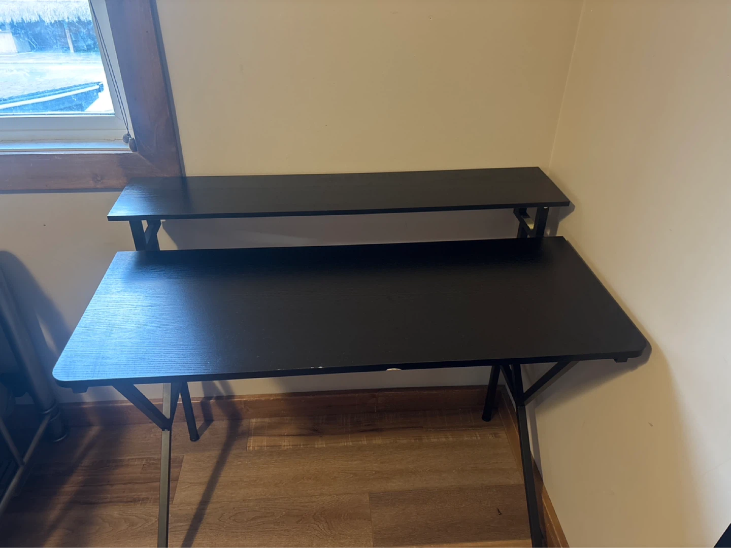 Black computer desk with riser shelf