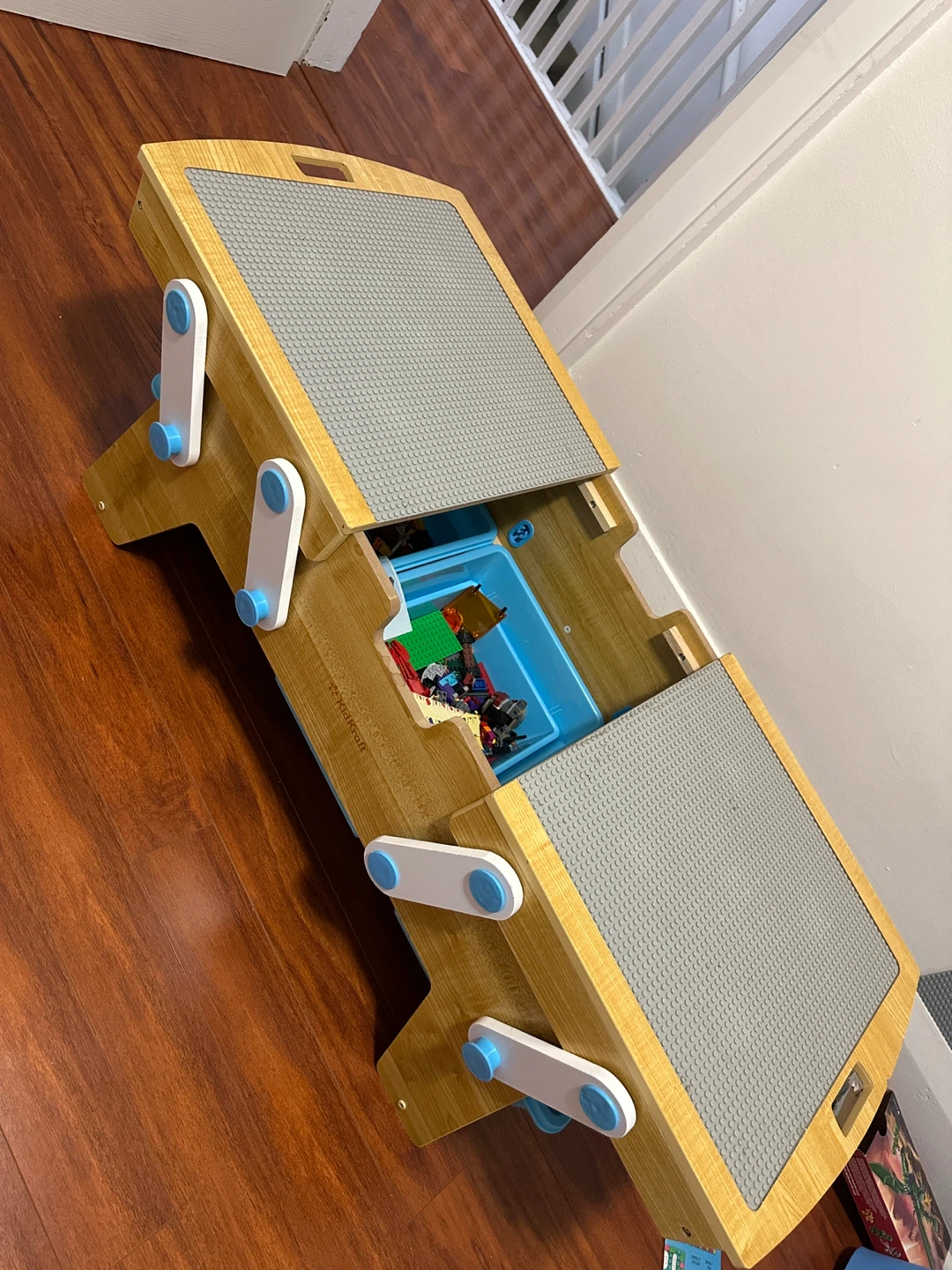 KidKraft Wooden Activity Table with LEGO pieces inside