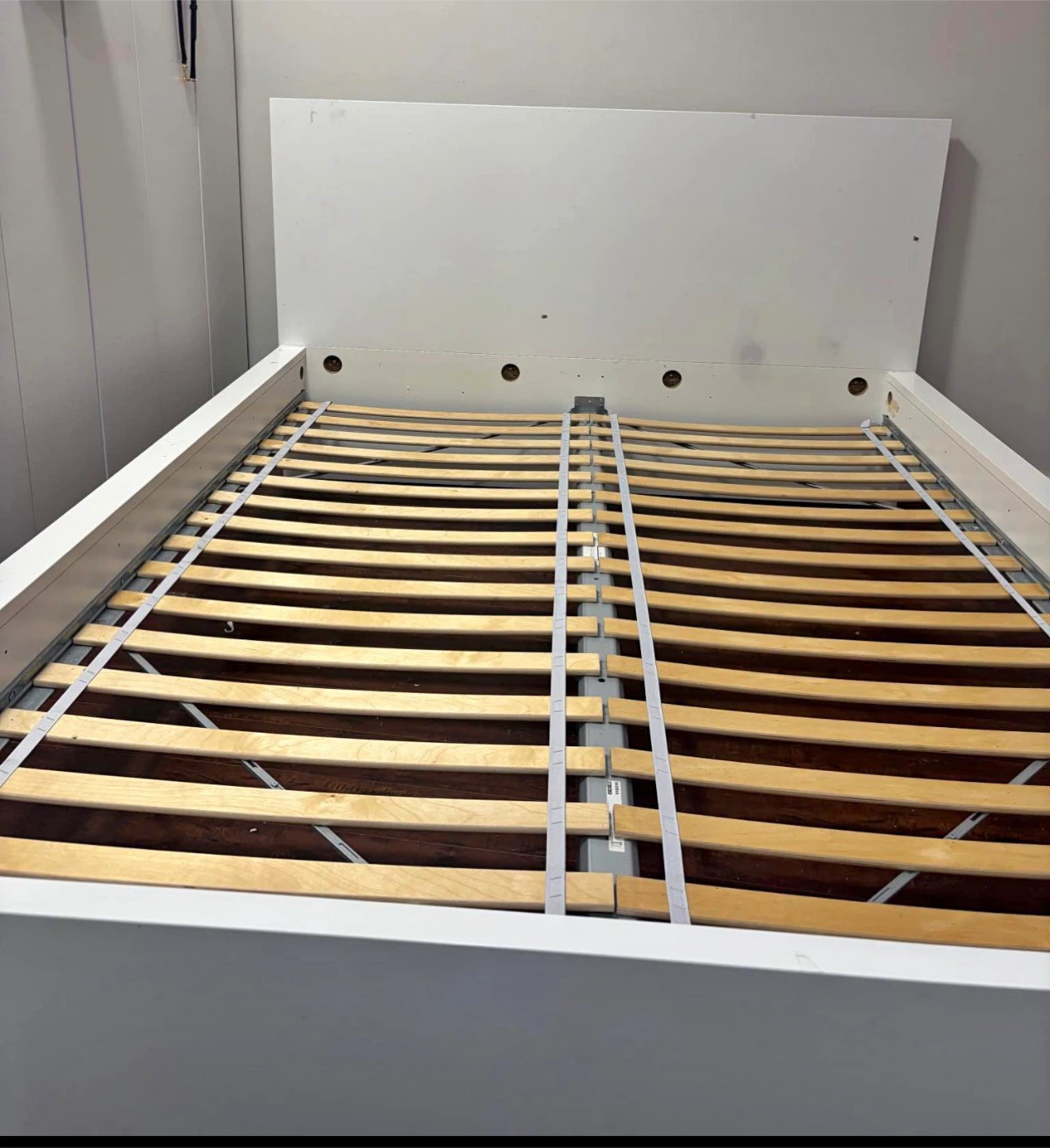 White queen sized bed frame with mattress