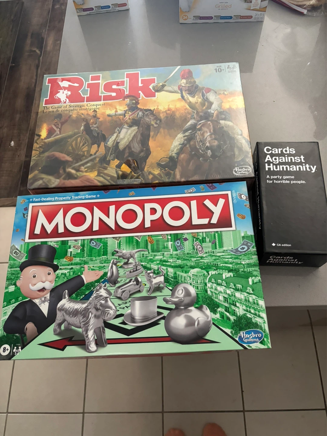 Risk and Monopoly plus Cards Against Humanity CA Edition