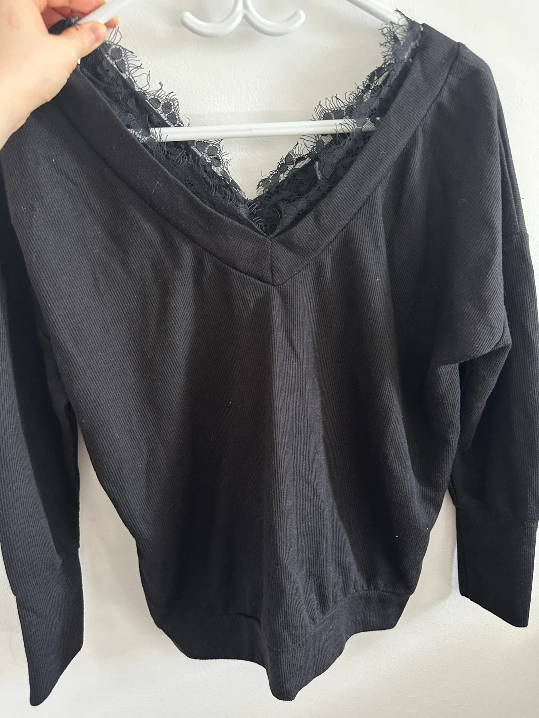 Black long-sleeved top with lace trim