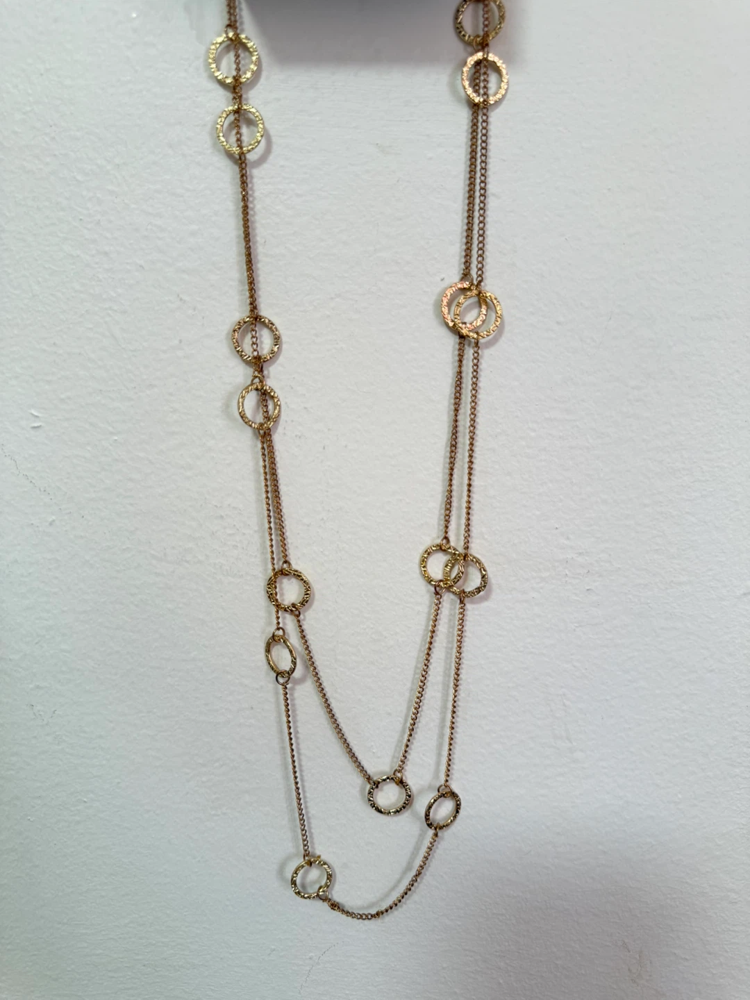 Gold tone layered necklace with circles