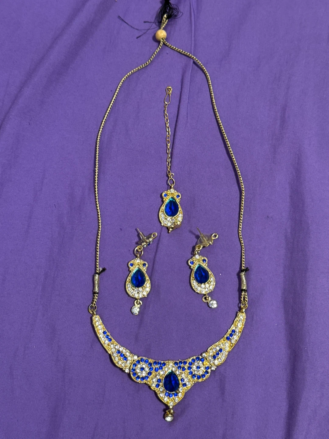 Gold-tone necklace and earring set with blue stones