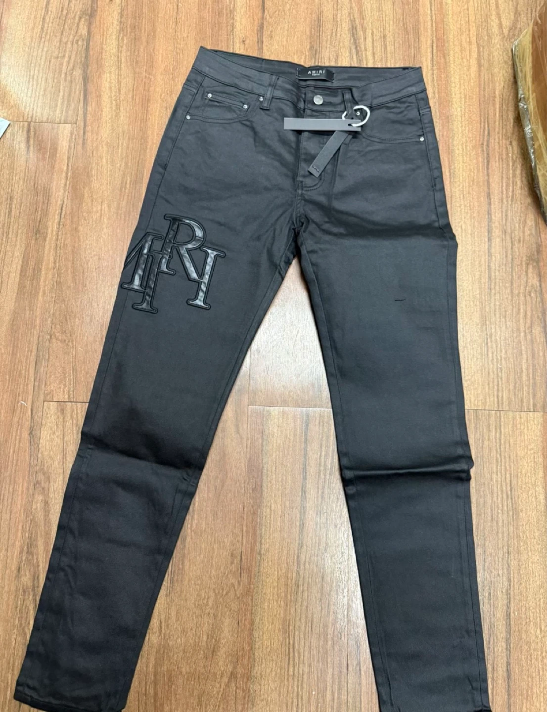 Amiri Staggered Logo Waxed Skinny Jeans - Black